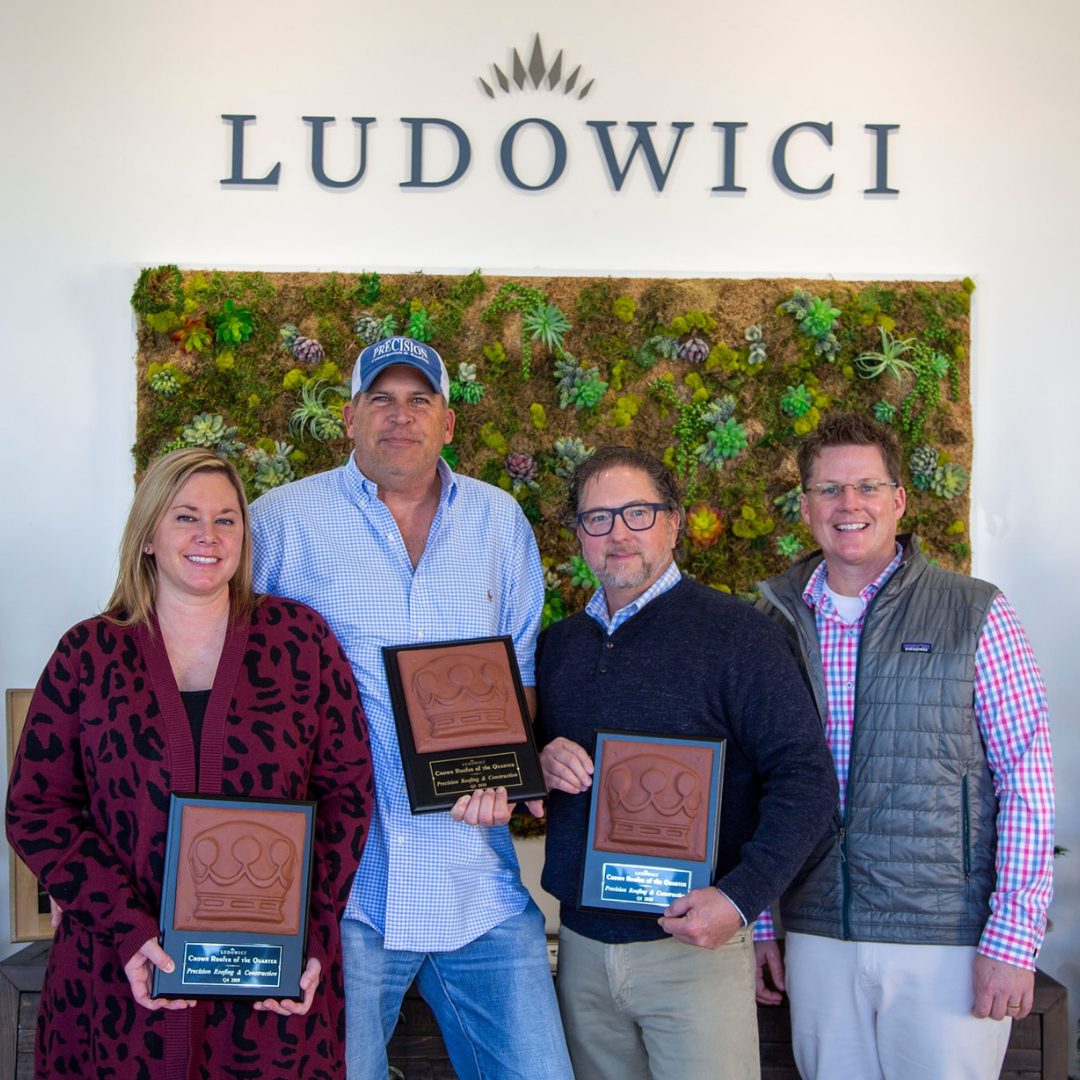 Precision leaders holding their Ludowici Roof of the Year plaques