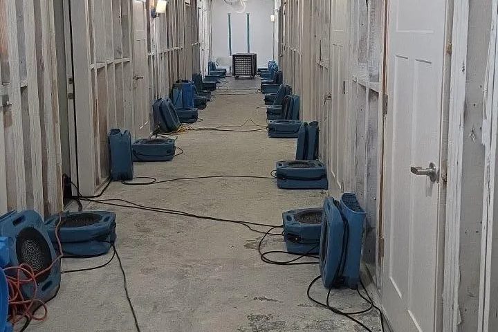 Capital Restoration air movers drying a hallway