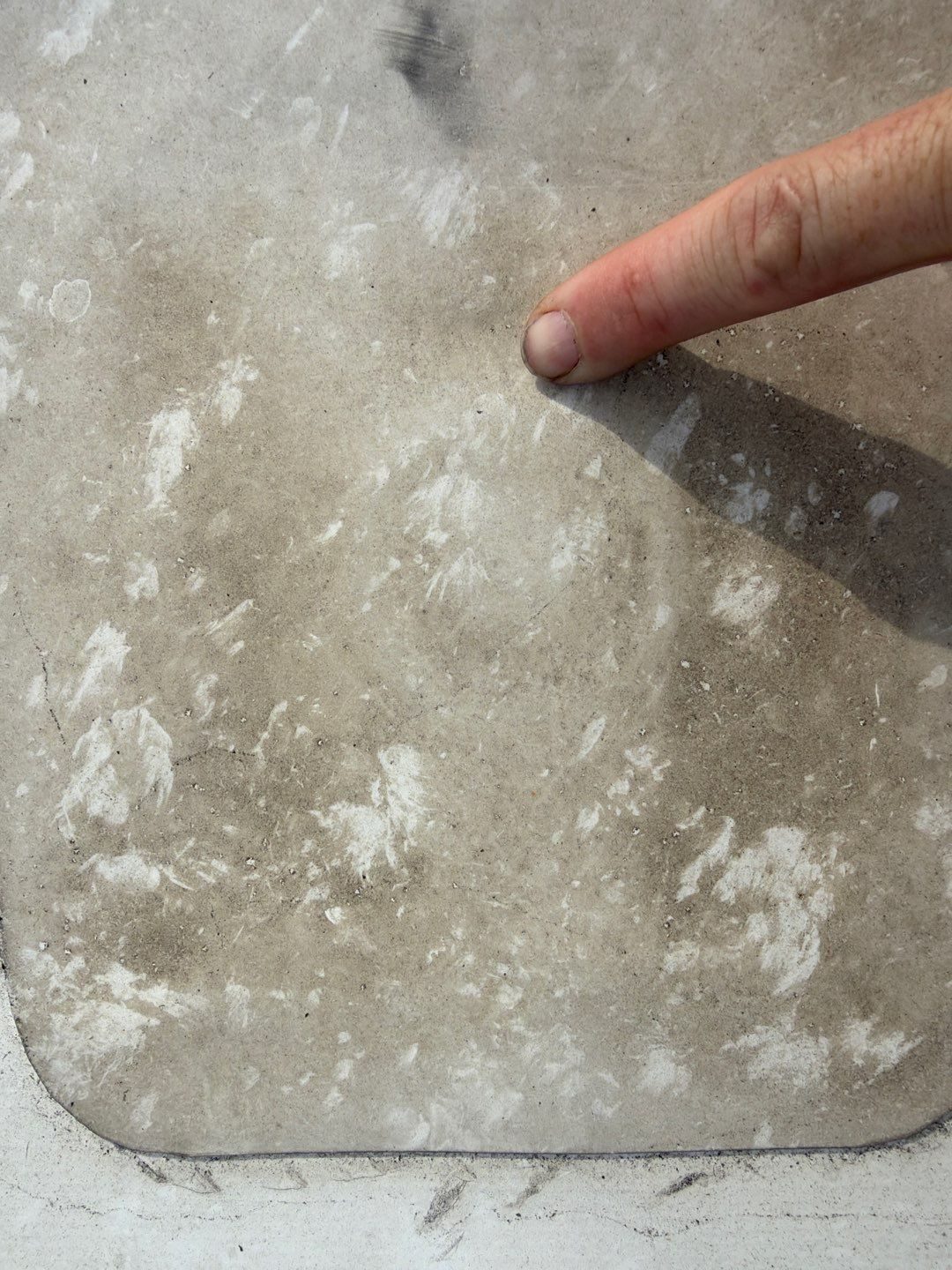Hail bruising marks on a flat roof membrane