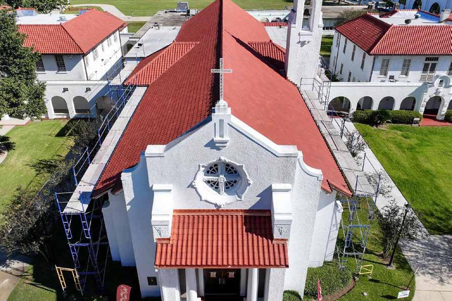St. Charles Borromeo Catholic Church with its restored red clay tile roof, aerial view