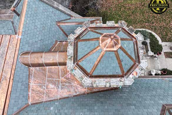 Octagonal copper and glass cupola on a slate roof, from above