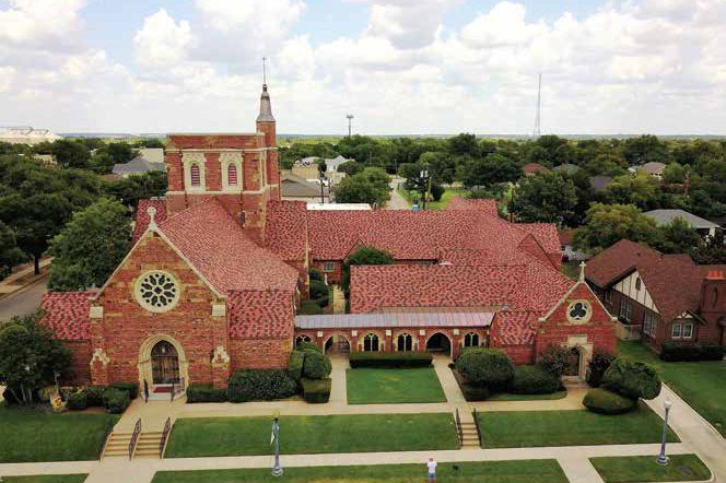 St. John's Anglican Church with a red clay tile roof, aerial view