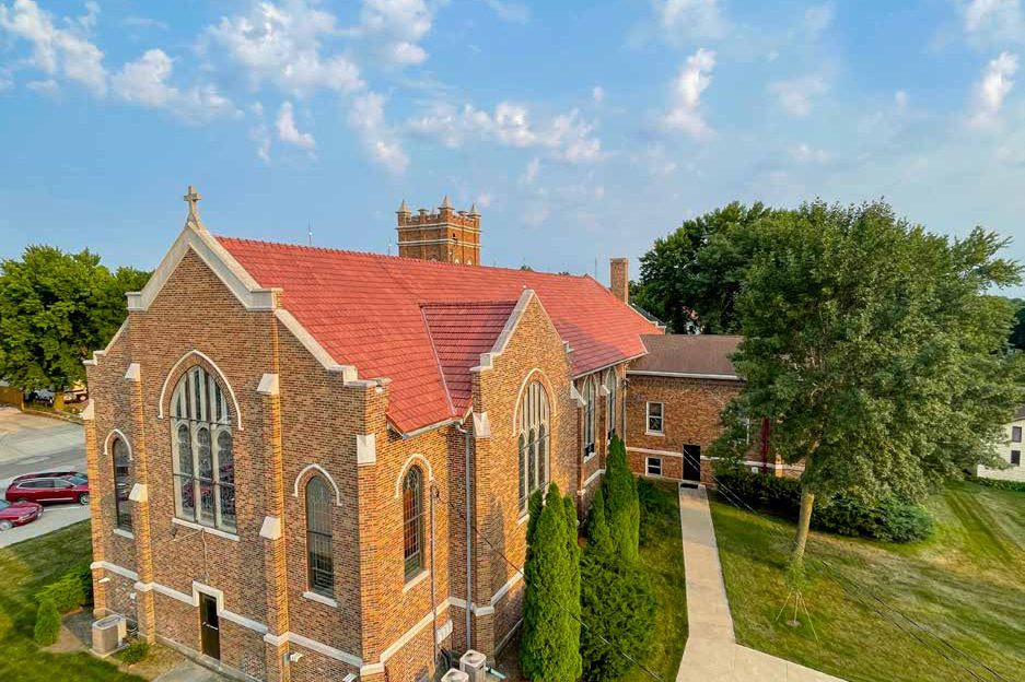 Zion Church, a brick church with a new red clay tile roof