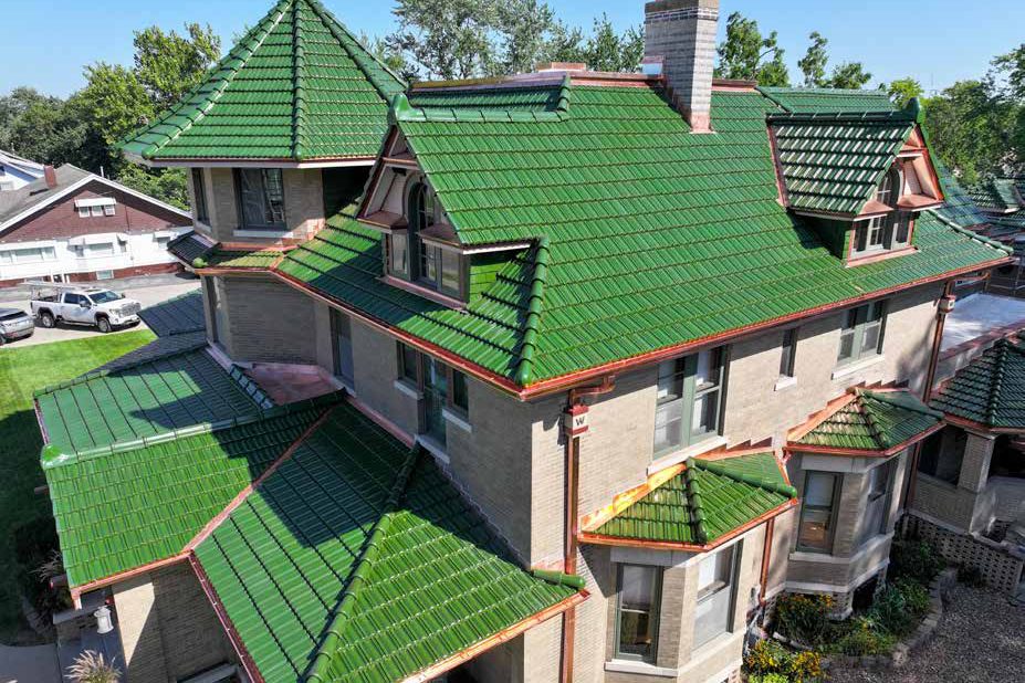 Victorian home with a green Ludowici clay tile roof