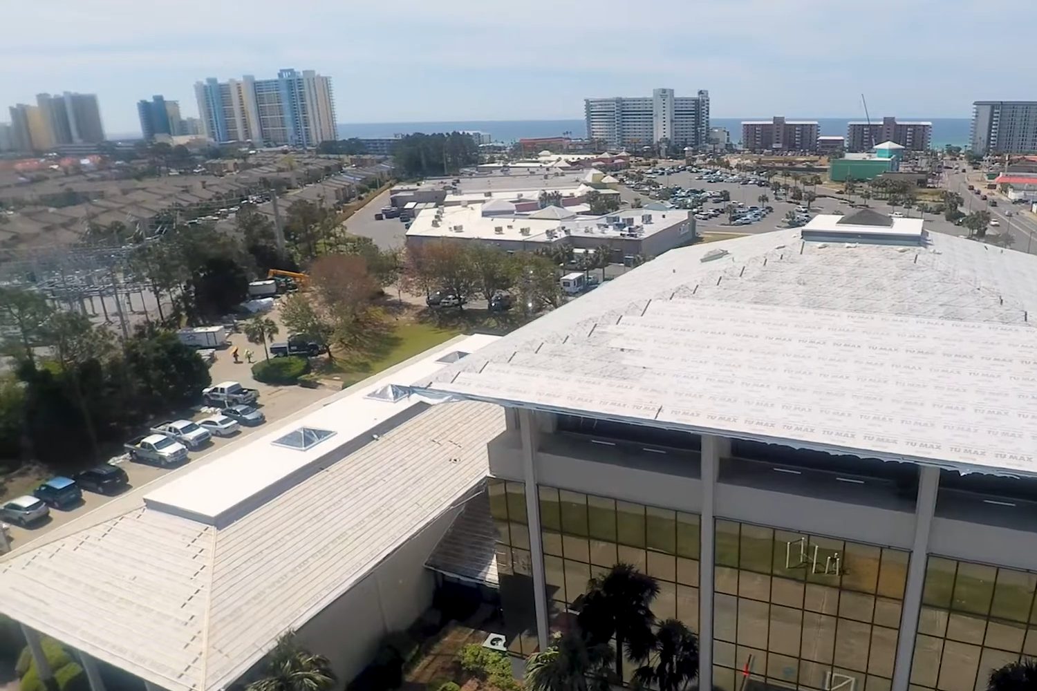 Beach Professional Center office building with its roof being replaced, aerial view