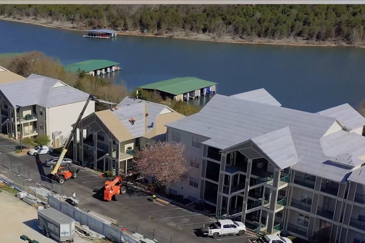 Emerald Bay Yacht Club buildings on the lake getting new standing seam metal roofs