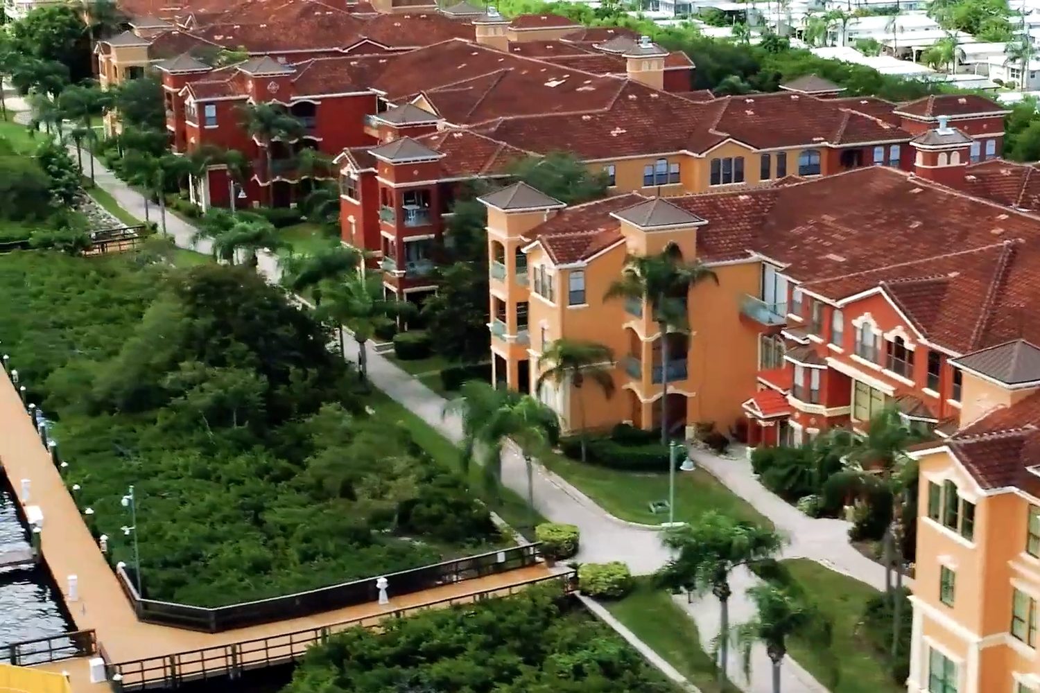 Grand Bellagio at Baywatch condominiums with new clay tile roofs, aerial view