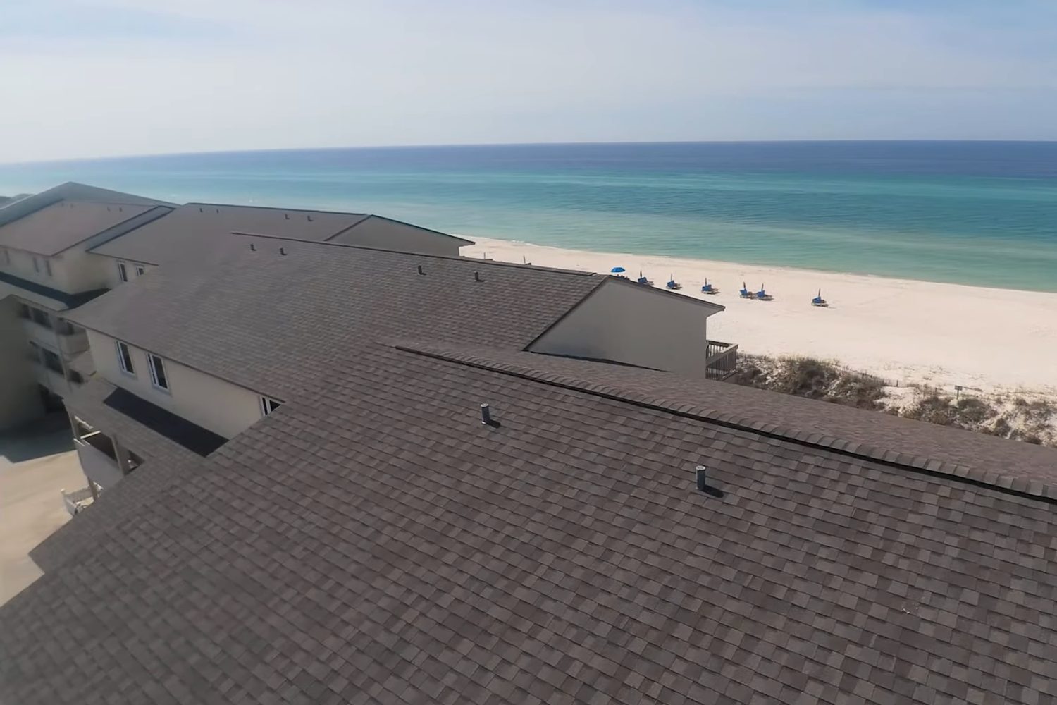 Ramsgate Harbour condominiums on the beach with new shingle roofs, aerial view
