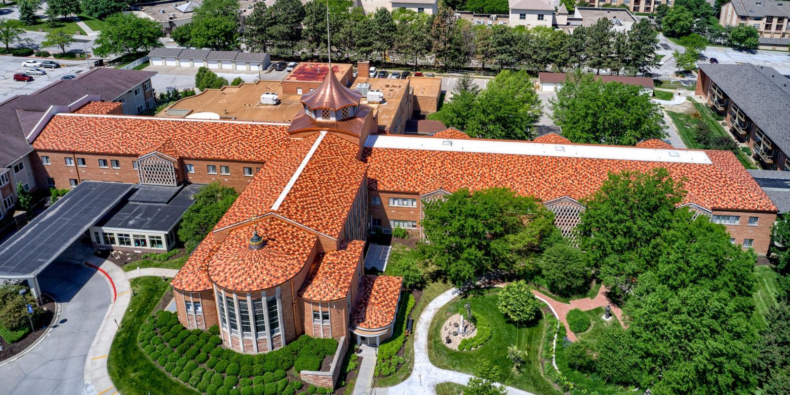 New Cassle retirement home with a Ludowici clay tile roof, aerial view