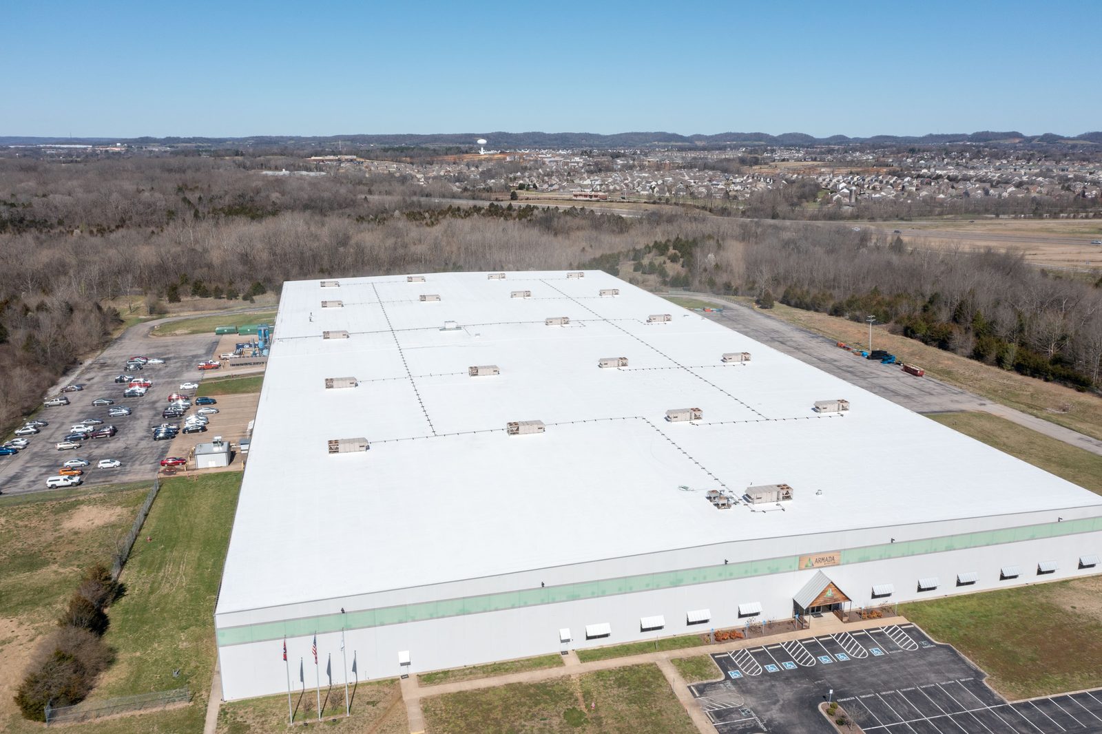 Distribution center with a white membrane roof, aerial view