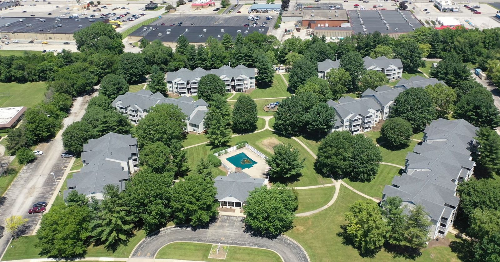 Apartment community with new roofs, aerial view